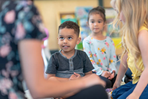 istock Multi-ethnic group of preschool students in class 1168223081