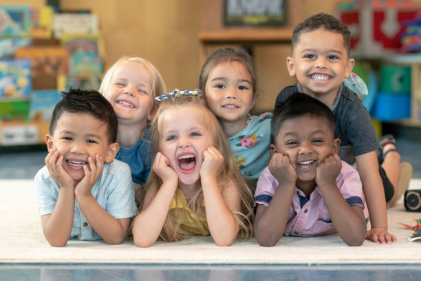 istock Group of smiling preschool students 1168223102