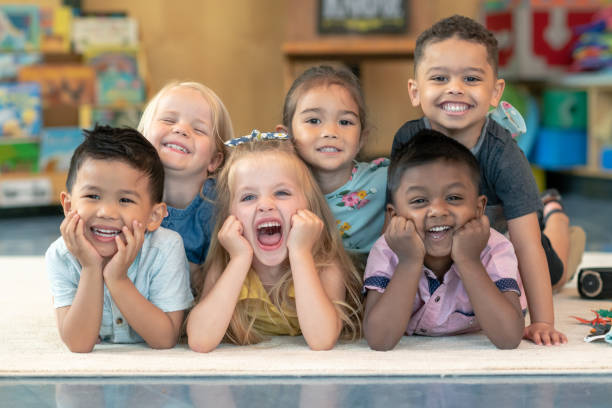istock Group of smiling preschool students 1168223105