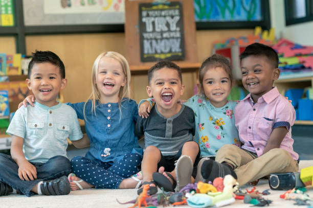 istock Group of smiling preschool students 1168223110