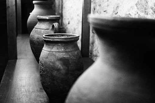 Old Olive oil stock pots on shelf in a old fatory.