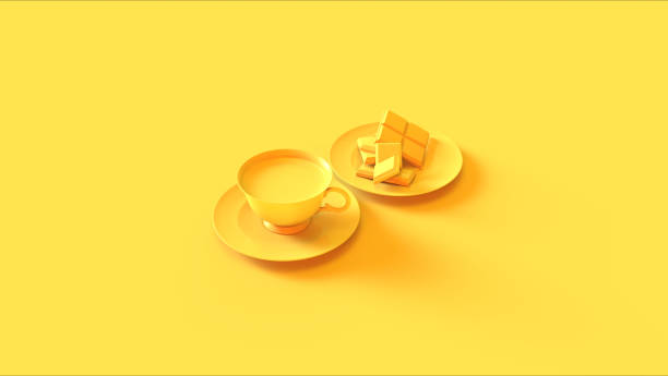 istock Yellow Tea Cup an Saucer with some Chocolate 1168225239
