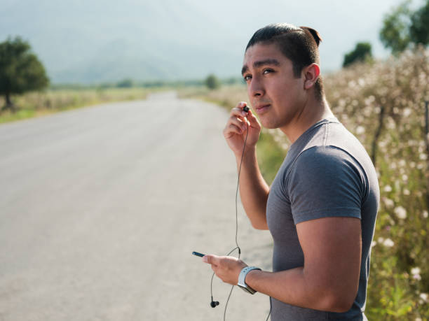 istock Fit young man wearing earphones 1168225664