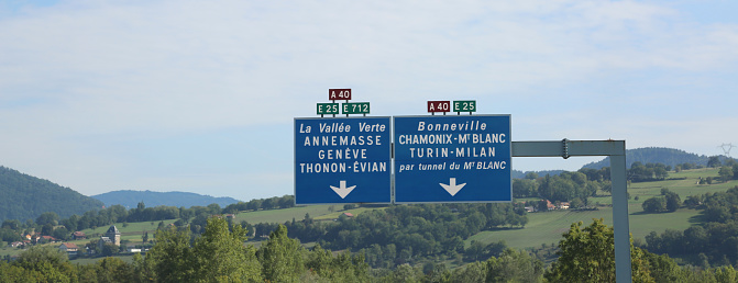blue road sign with white lettering on the French highway