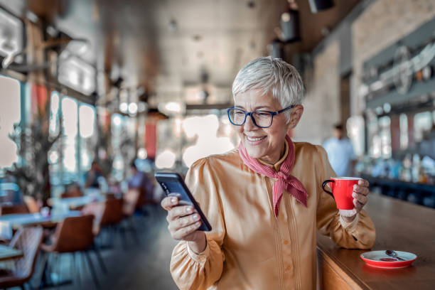 istock Senior woman in coffee shop 1168227646