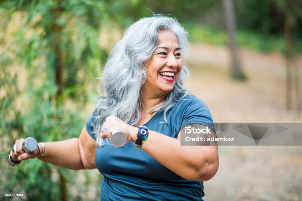 Mature Mexican Woman Working Out A Mature Mexican Woman Working Out Exercising Stock Photo