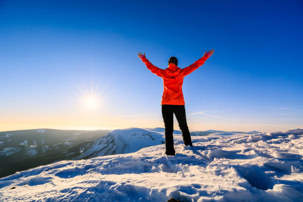 istock Young female trekker watching sunset in the mountains 1168227705