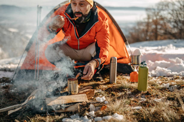 istock Man preparing food on mountain 1168228384