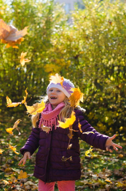 istock child in autumnal time 1168228984