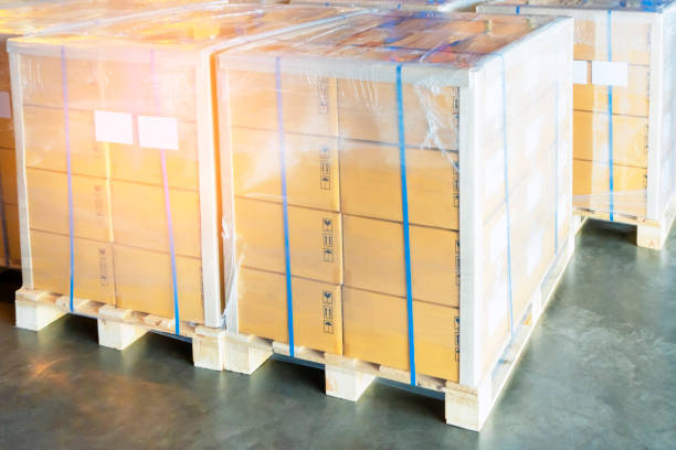 istock stacked of package boxes on wooden pallet cargo export for transportation at distribution warehouse. 1168229118