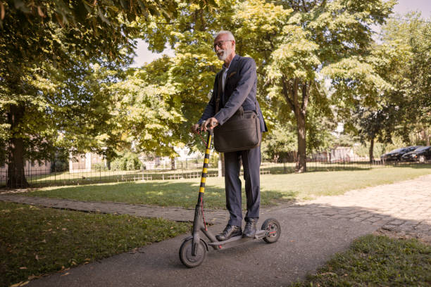 istock Businessman riding electric scooter 1168231283