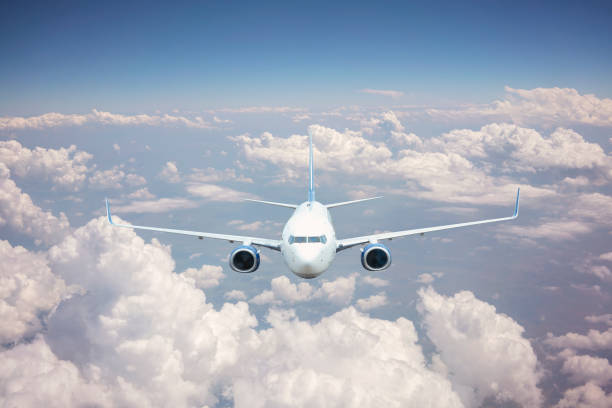 istock Passenger jet airplane flying above clouds. 1168234531