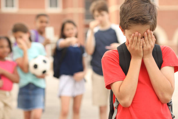 istock Elementary age boy being bullied at school. 1168234777