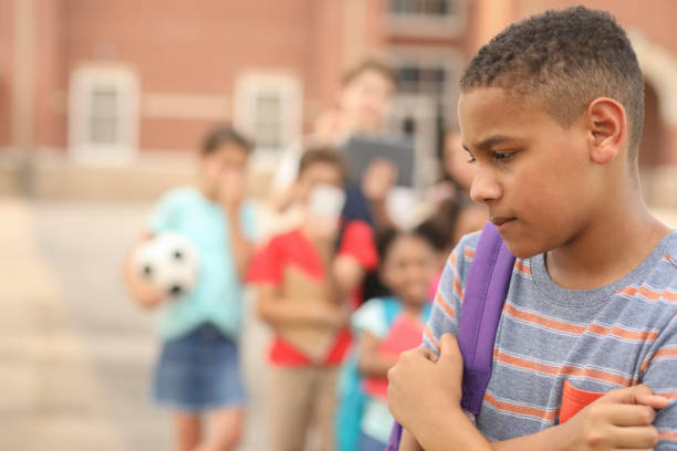 istock Junior high age boy being bullied at school. 1168235967