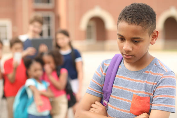 Junior high age boy being bullied at school.
