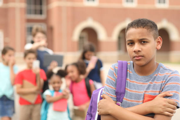 istock Junior high age boy being bullied at school. 1168236018