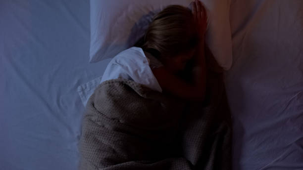 istock Female suffering nightmare, lying in bed at night, sleeping disorder, depression 1168236208