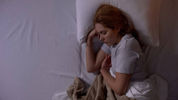 istock Beautiful lady sleeping sweetly in comfortable bed, sleeping quality, relax 1168236545