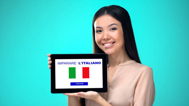 istock Female holding tablet with learn italian application, ready to start course 1168236955