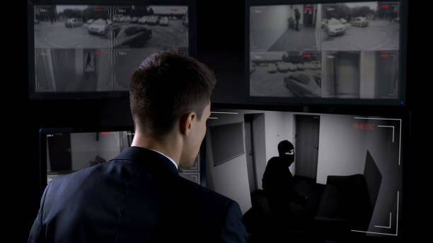 istock Security guard in front CCTV footage watching bank robbery, safety and guarding 1168237333