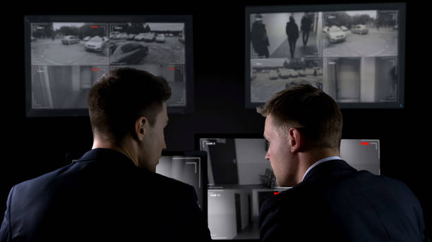 istock Two detectives checking surveillance camera records after crime, investigation 1168237392
