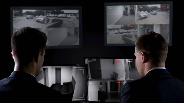 istock Two detectives looking through camera records, crime investigation, evidence 1168237398