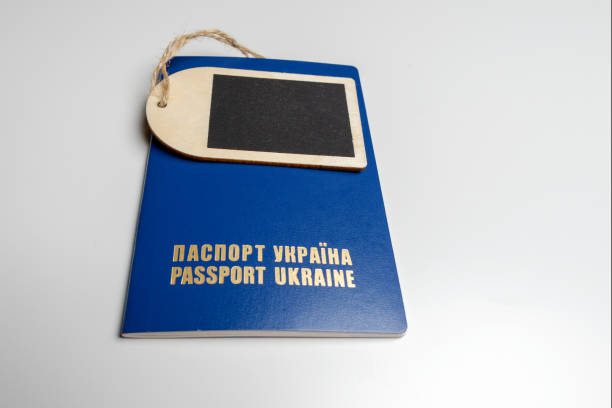 istock Tag with a blue passport on a white table, mockup 1168240931