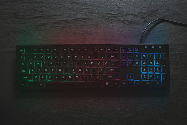 Top view of rgb computer keyboard on black background stock photo