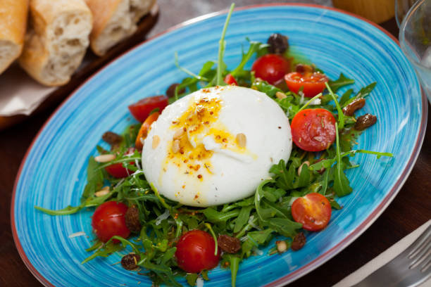 istock Salad with Italian burrata cheese; arugula and cherry tomatoes 1168245276