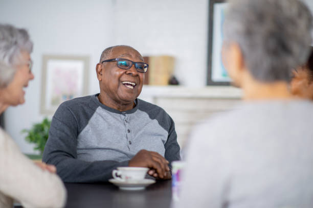 Senior man having tea with friends