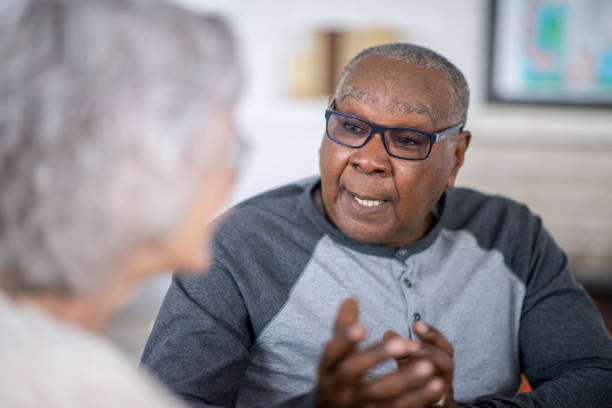 istock Senior man speaking to friends 1168246587