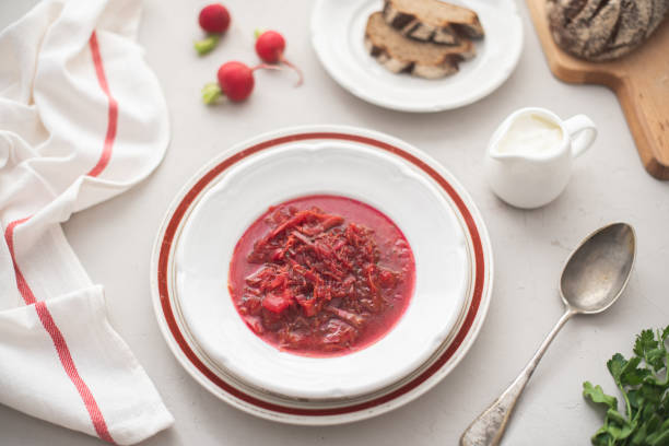 istock Borscht, Traditional Ukrainian vegetable soup with beetroot and sour cream 1168248310
