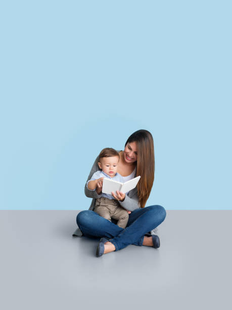 istock Mother reading her baby a book 1168249815