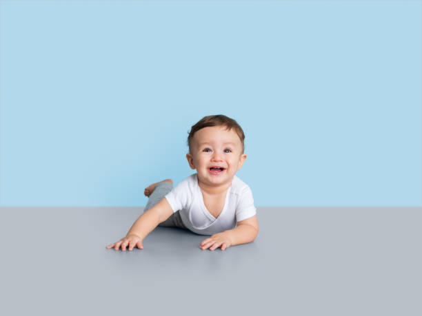 istock Baby boy on the floor smiling at the camera 1168249903