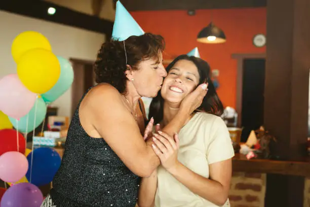 Grandmother and granddaughter celebrating a birthday party
