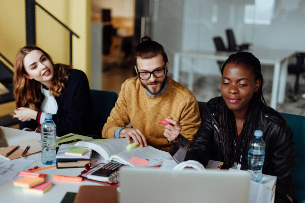 istock Group of Students Socializing and Studying in University 1168251393