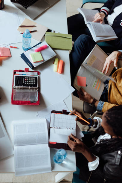 istock Group of Students Socializing and Studying in University 1168251399