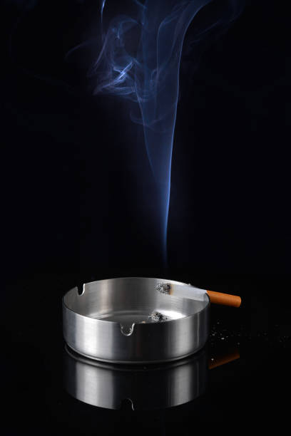 istock Smoke rising from a cigarette in an ashtray 1168251625