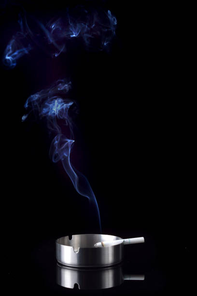 istock Smoke rising from a cigarette in an ashtray 1168251640
