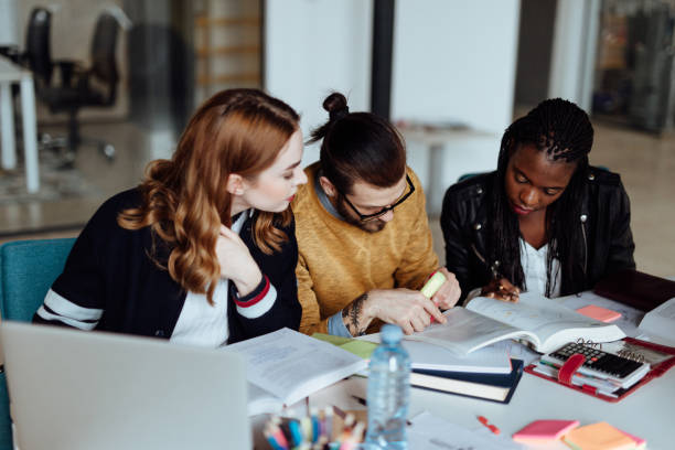 istock Group of Students Socializing and Studying in University 1168251679