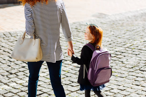 istock Joyful little female talking to her mommy 1168252682