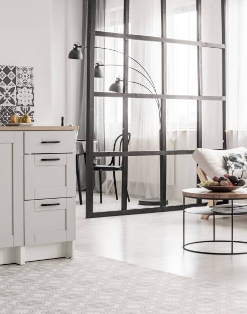 istock Open space kitchen and living room interior with mullions wall and scandinvian design 1168252968