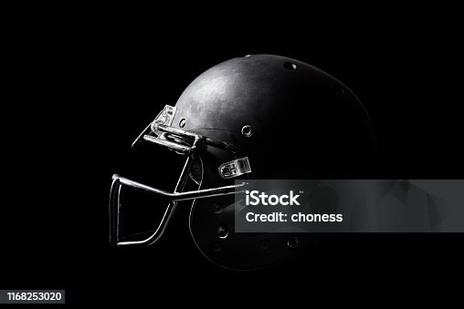 istock Football helmet on black background. 1168253020