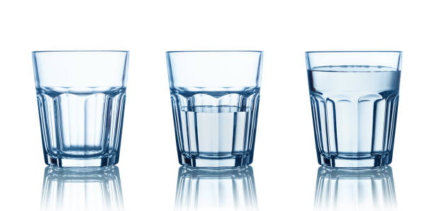 istock Empty,half and full water glasses . Isolated on white 1168253156