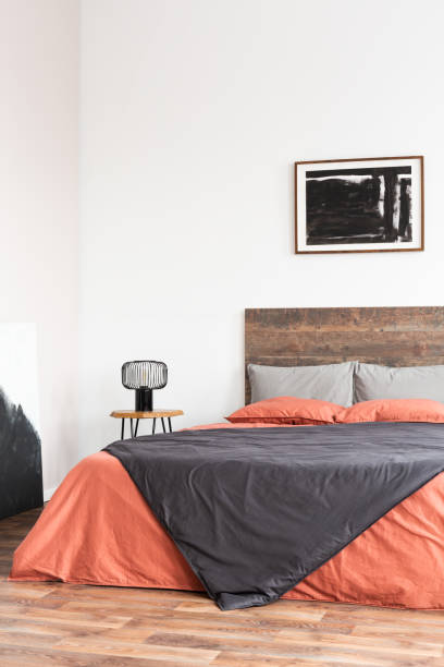 istock Simple, bedroom interior with empty white wall and cozy bedding 1168253214
