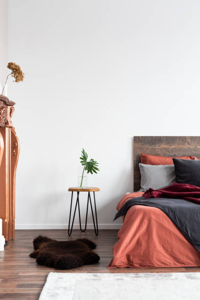 istock Fireplace portal and copy space on empty white wall of bedroom interior 1168253225