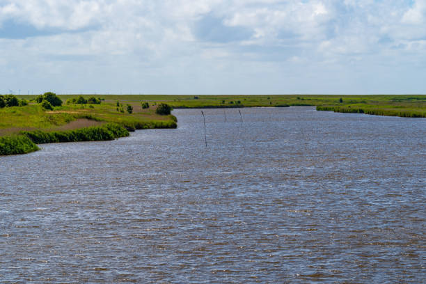 istock View over a sewer with dramatic clouds in the blue sky in Friesland 1168253436