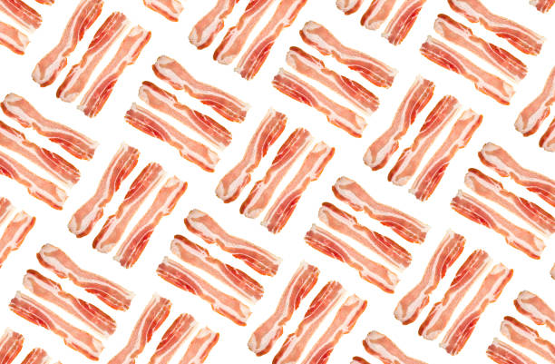 A slice of bacon on a white background. Three raw bacon close up on a white background. A slice of bacon on a white background. Three raw bacon close up on a white background. twisted bacon stock pictures, royalty-free photos & images