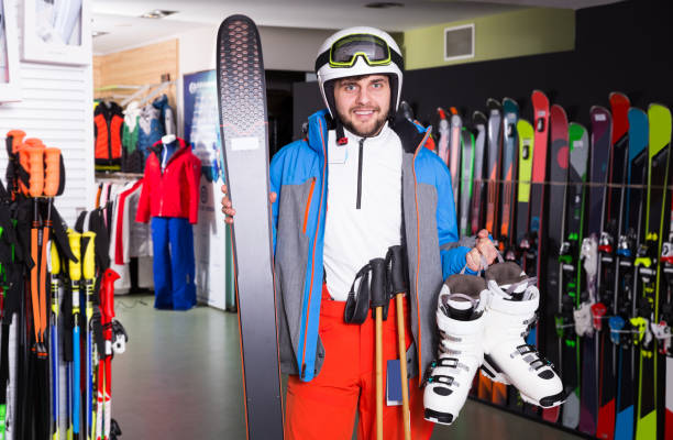 istock guy  buying purchased ski equipment 1168254527