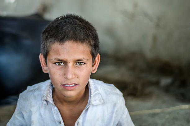 istock a blind young child is wearing black glasses 1168254924